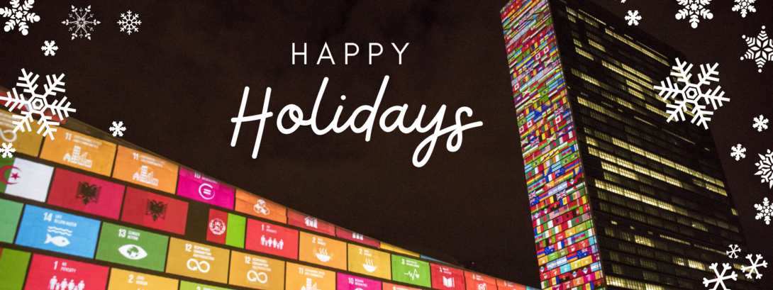 UN Building in New York, covered with SDG logos in colors, in times of holidays